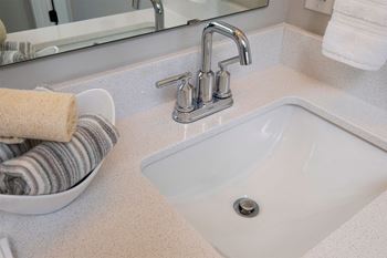 Gooseneck faucet & brushed nickel bathroom fixtures